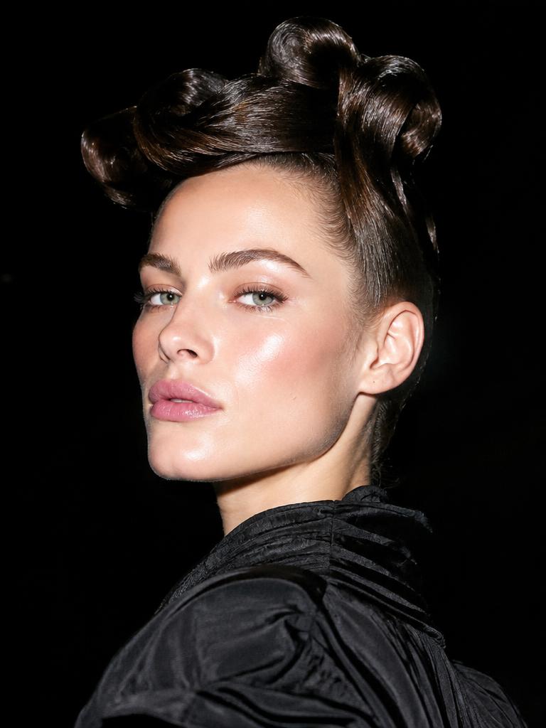 Editorial fashion portrait, sculptural hair, hard flash on black